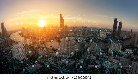 Wireless network and Connection technology concept with Abstract buildings and city background
