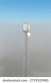 Wireless network tower standing in misty winter scenery