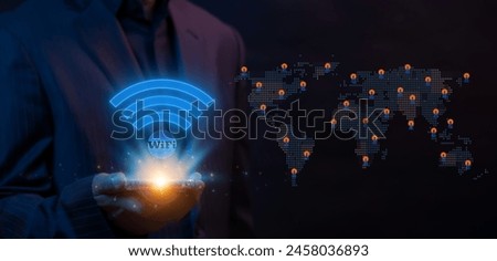 Wireless networking digital futuristic technology innovation. Business communication social network concept. Businessman holding smartphone to show neon line of Wifi internet network symbol icon.