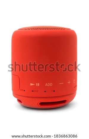 Wireless red music speaker isolated on white background
