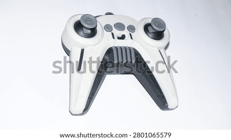 Wireless remote controller isolated on a green background. Modern electronic device featuring dual joysticks, suitable for drone operation, gaming technology, smart control, and innovation concepts.