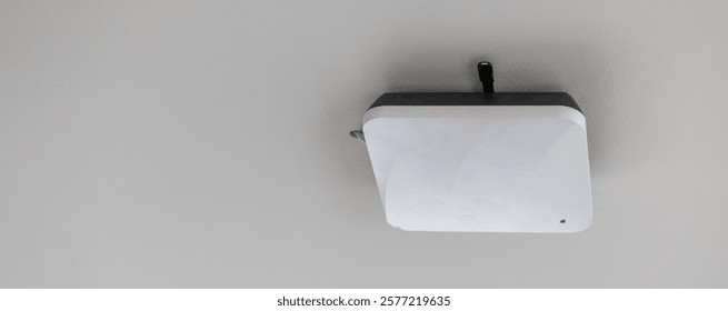 wireless router for network, hang on the ceiling. world wide network technology. WIFI router or Wireless Access Point setup at ceiling for Internet connection space.