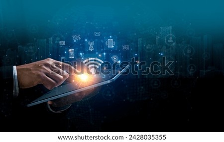 Wireless systems and internet of things connection technology concept. Businessman touching on tablet with virtual screen of free WiFi network signal technology internet connection communication.