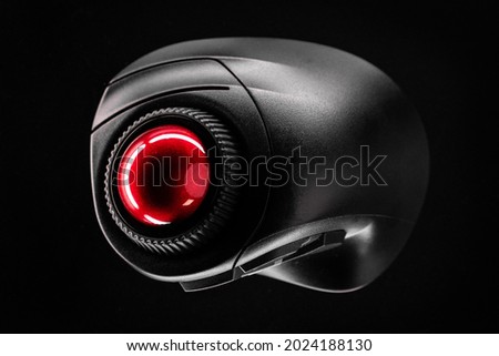 Wireless Trackball Computer mouse on a black background. Top View