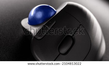 Wireless Trackball Computer mouse on a black background