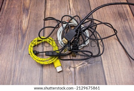 The Wires close-up. A bundle of wires. Tangled wires. Miscellaneous wires are tangled.