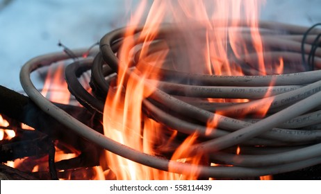 wires on fire. Firing winding insulation of electrical wiring in the fire in the winter woods