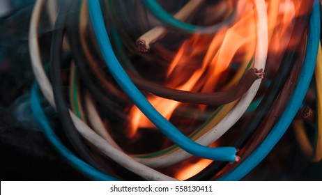 wires on fire. Firing winding insulation of electrical wiring in the fire close-up