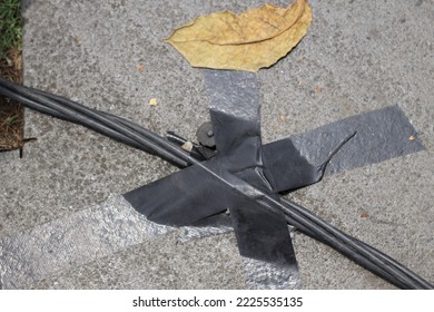 wires on the floor and locked with black duct tape. - Shutterstock ID 2225535135