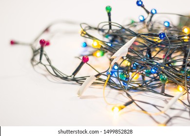 Wires Rewound With Electrical Tape On A Christmas Garland. Independent Repair Of Electrical Appliances And A Fire In The New Year, Fire Safety Idea