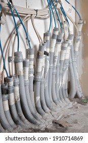 Wiring In Cable Or Mdf Closet. Setup Of Private Telecommunication Network Cable Connect To Individual Apartments In Strata Building. Selective Focus With Blurry Background Wiring And Dirty Floor.