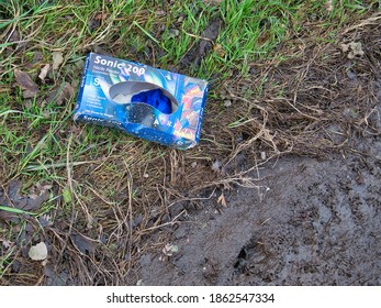 Wirral, UK - Nov 23, 2020: A Nearly Empty Box Of PPE Nitrile Gloves Discarded Thoughtlessly At The Side Of A Country Lane, Causing Environmental Damage.