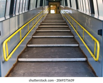 Wirral, UK - Oct 30 2021: A Stepped Ramp With Yellow Handrails Gives Access To A Station Platform On A Regional Rail Network.