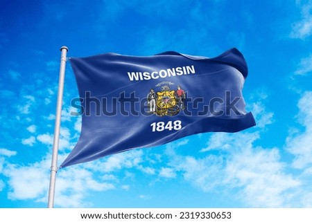 Wisconsin flag waving in the wind, blue sky background