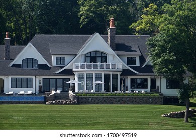 Wisconsin, USA; June 23, 2019: An elegant lakefront vacation home along the shore of Lake Geneva.