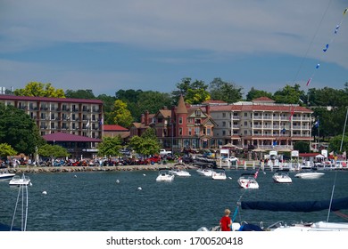Wisconsin, USA; June 23, 2019: Lakefront hotels in Lake Geneva. A popular tourist destination for summer vacation, its parking lots crowded with visitors and their vehicles.