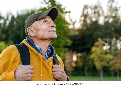 Wisdom Senior Hiker Man With Packback Looking On Top Of High Mountain Autumn Forest Background Side View