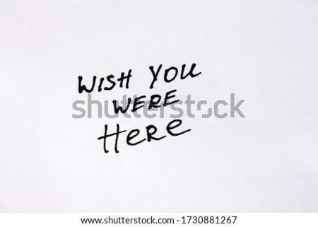 Wish you were here. Handwritten message on a white background.