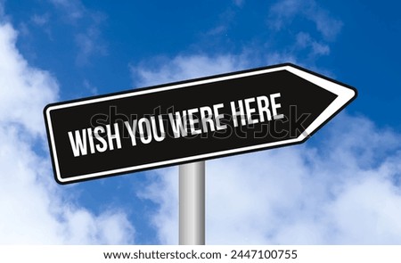 Wish you were here road sign on blue sky background