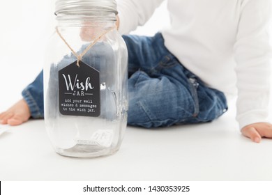 Wishes Granted! Wish Jar And Young Child  On White Background