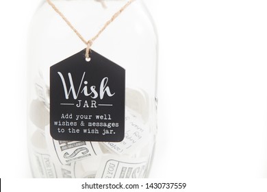 Wishes Inside Wish Jar On White Background - With Copy Space.