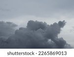 Wisps of cloudy clouds with a unique shape.Full frame of the low angle view of clouds of storm of white and gray color, with dramatic shadows 