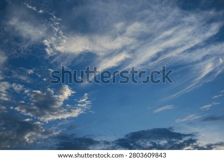 Wispy Clouds in Blue Sky
