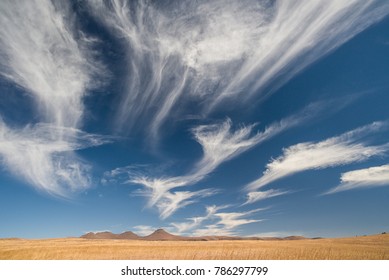 Wispy Clouds in Desert