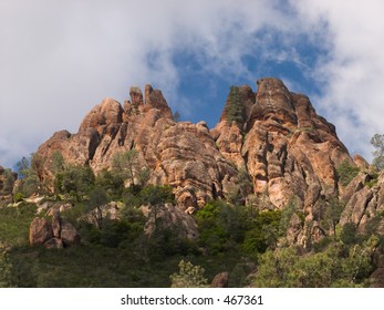 Wispy clouds hang over some of the massive monoliths and spires in the Pinnacles National Monument, California, formed by an ancient volcano and the San Andreas Fault