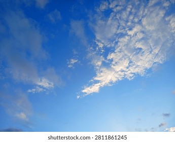 Wispy white clouds drifting in a deep blue sky with atmosphere background sunshine peaceful landscape environment