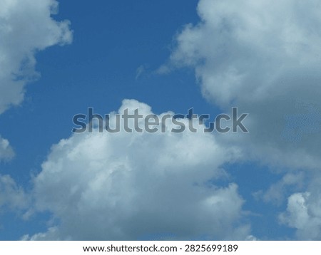 Wispy white clouds on blue sky