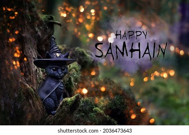 Witch Black Cat Toy In Mystery Forest. Autumn Background. Black Cat - Symbol Of Witchcraft, Samhain Sabbat And Halloween Holiday. Happy Samhain Greeting Card