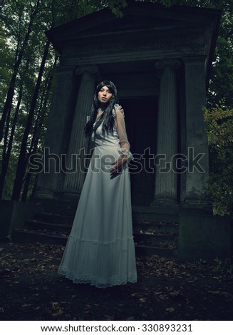 Witch from a crypt in the cemetery
