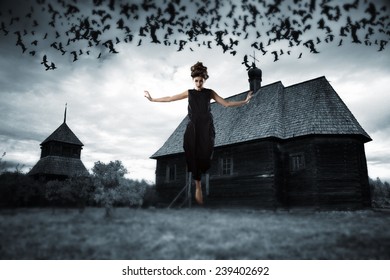 Witch Floating In The Air. Picture In The Style Of A Horror Movie.