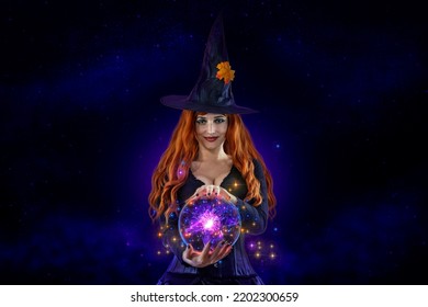 Witch On Halloween Making Witchcraft, Magical Fireball, Spells. Female Wizard Fairy Character For All Saints' Day. Fantasy Gothic Red-haired Vampire Girl In Carnival Black Dress. Woman Enchantress