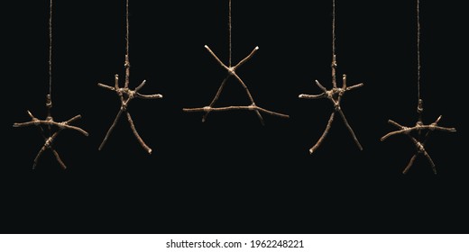 Witchcraft sticks symbols. Magic occult symbol. Many totems hanging on dark background. Mysticism and black magic concept.