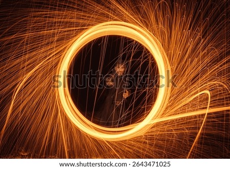 A witcher casting a magic spell in the form of a circle of fire that opens a portal and releases sparks, like in superhero films.