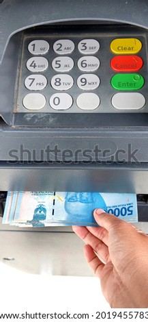 withdraw money from automatic teller machine