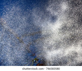 Within the cloud and falls. Hydrological cycle. Spray of water in evening sky blur