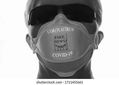 Without A Face. Woman In A Protective Mask And Black Glasses On A White Background. Text, Coronavirus, COVID-19, Fake News. The Image Is Out Of Focus.