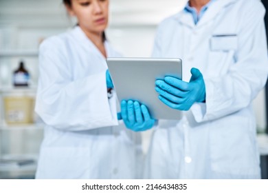 .Without Science There Can Be No Knowledge Generation. Closeup Shot Of Two Scientists Working Together On A Digital Tablet In A Lab.