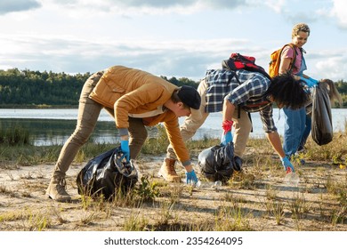 Witness the inspiring unity of a diverse group of young volunteers as they come together to make a positive impact on the environment. This image captures their collective effort in cleaning up the - Powered by Shutterstock