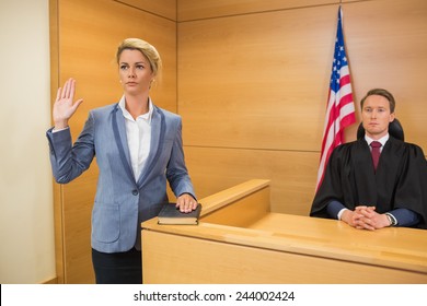 Witness Taking An Oath In The Court Room