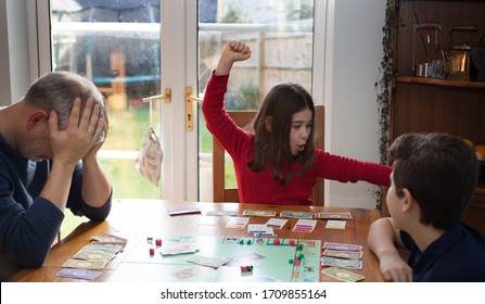 Witney, Oxfordshire, UK 02 03 2020 A Family Playing Monopoly