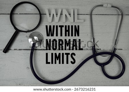 WNL Within Normal Limits text with Stethoscope on wooden background