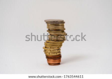 Wobbly euro coins with a white background. 