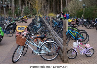 Woburn, Bedfordshire/UK - March 23 2019: Family Dropping Off Cycles At Woburn Center Parc, Cycle Park.