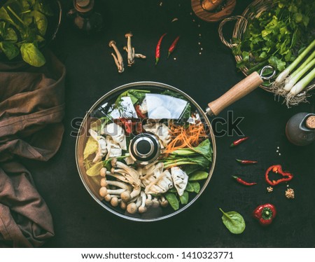 Similar – Image, Stock Photo Female hands making chicken skewers with vegetables for grilling