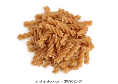 Wolegrain fusilli pasta from durum wheat isolated on white background with clipping path and full depth of field. Top view. Flat lay.