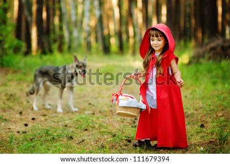 the wolf pursues the girl.  the fairy tale 